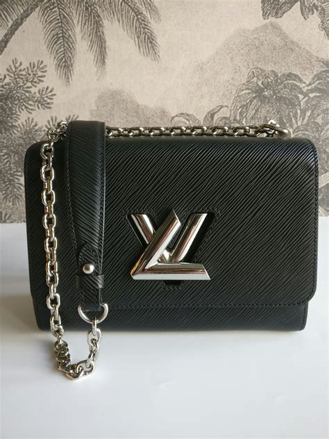 lv twist chain wallet price|Twist: LV Brand Mark Twist Lock Handbags .